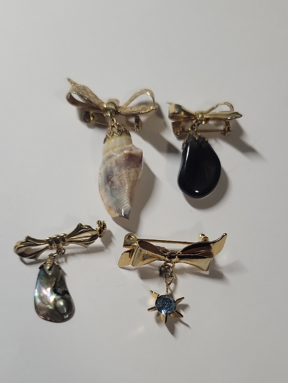 Gold Tone Bow Drop Shell and Gemstone Brooch Set - Black, Cream,